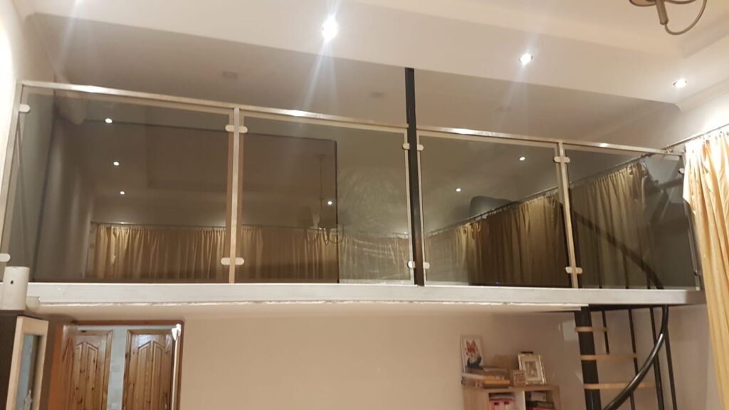 a glass railing on a balcony